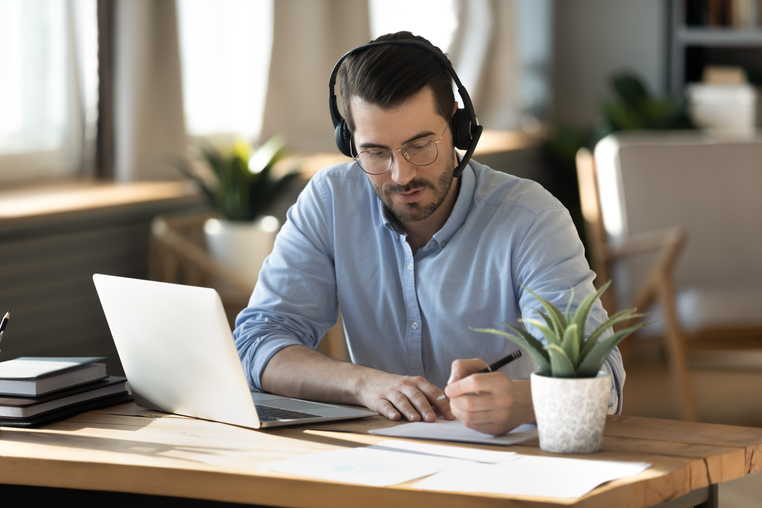 Office worker using business phone system from home.