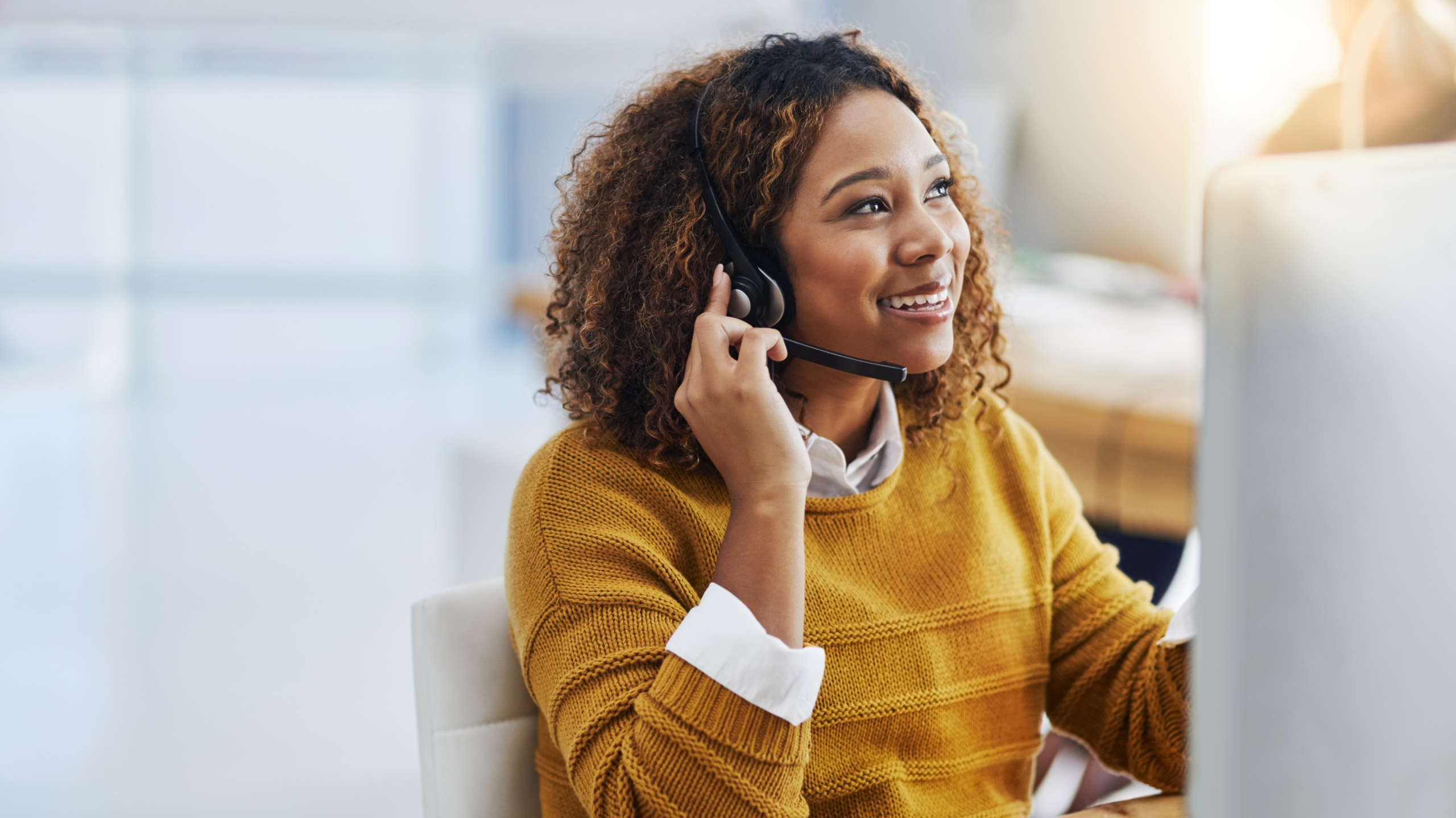 Office worker speaking via a cloud phone system