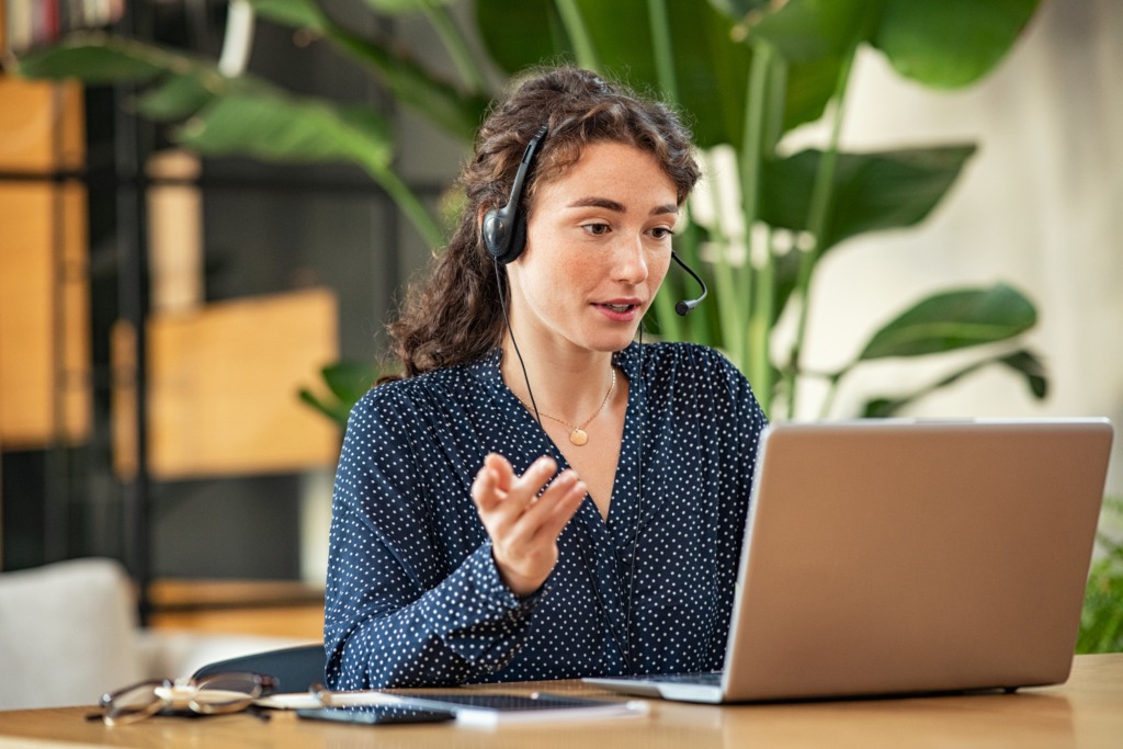 Lady managing call traffic with an effective call management system. 